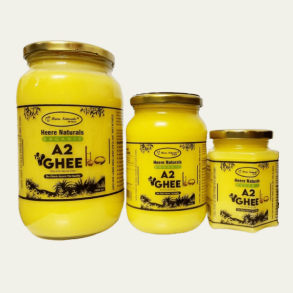 Image of Heere Naturals A2 Gir Cow Pure Aromatic Ghee - a jar filled with golden, creamy ghee, showcasing its rich texture and purity